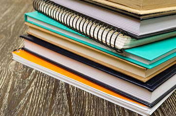folded stack of workbooks.