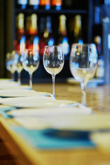 Wine glasses on the table in restaurant, bar or wedding reception