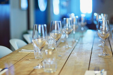 Wine glasses on the table in restaurant, bar or wedding reception