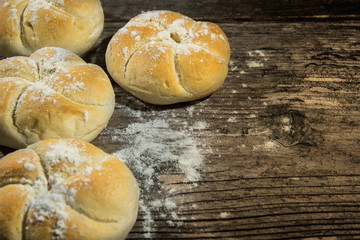 Bread loaf on a rustic wood . Free space for text. Top view