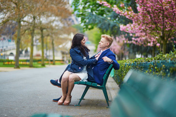 Romantic couple in Paris near the Eiffel tower