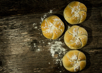 Bread loaf on a rustic wood . Free space for text. Top view