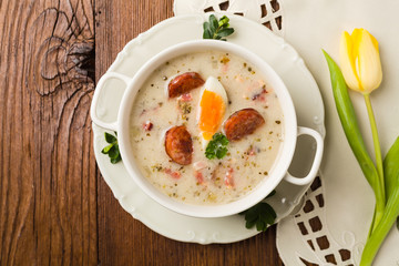 Traditional Polish white borsch with Easter decoration