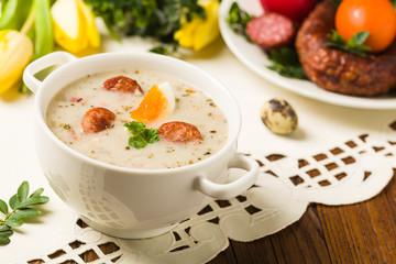Traditional Polish white borsch with Easter decoration