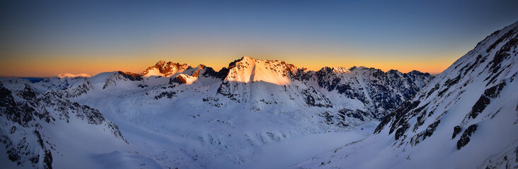 Fototapeta premium Panoramic view of Kozi Wierch at sunrise. Tatra mountain National Park