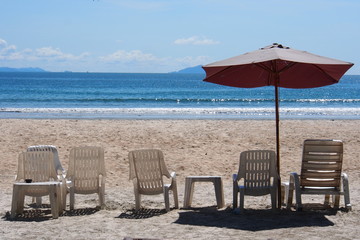 Beach chair with umbrella on the nice beach