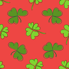 Clover seamless pattern. Clover pattern with three and four leaf green on red background. St. Patrick's Day hand-drawn doodle style clover endless repeat backdrop, texture, wallpaper.