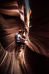 Backpacker Girl in Zebra Slot Canyon Escalante Utah