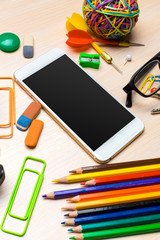 School supplies on wooden background