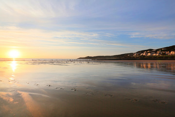 sunset over woolacombe beach in devon