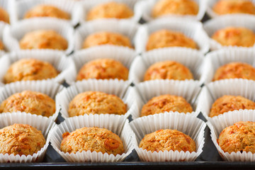  Homemade cheese muffins in paper cupcake cases. Shallow focus. close-up