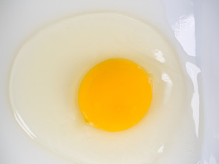 an uncooked cracked egg