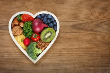 Healthy food in heart shaped bowl