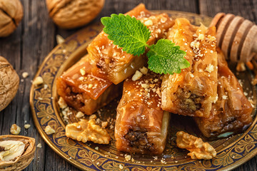 Traditional arabic dessert Baklava with honey and walnuts.