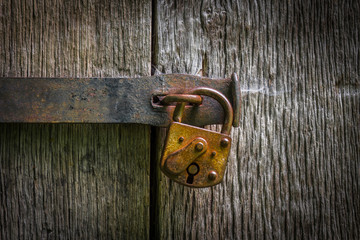 The lock on an old wooden door