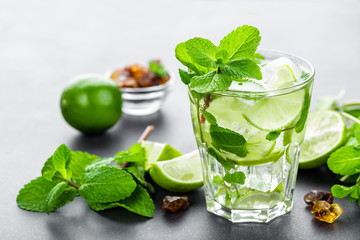 Mojito Cubano or caipirinha cocktail, iced drink with lime and mint
