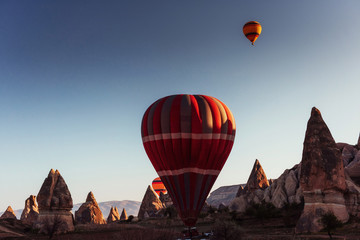 Amazing sunset over Cappadocia. Beautiful color balloons. Turkey