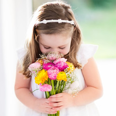 Little girl with flower bouquet