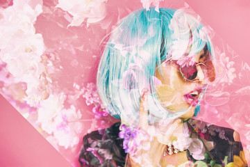 Double exposure of pop girl making the horns and flowers