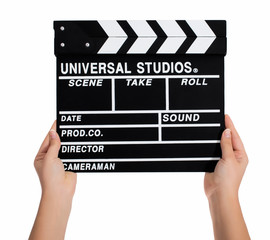 Obraz premium Hands holding a clapper board