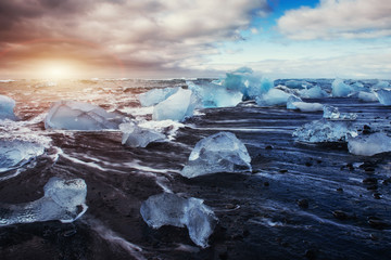 Jokulsarlon glacier lagoon fantastic sunset on the black beach, 