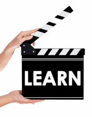 Hands holding a clapper board with LEARN text