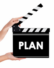 Hands holding a clapper board with PLAN text