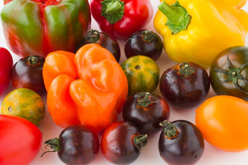 Red tomatoes on white background.  close up.