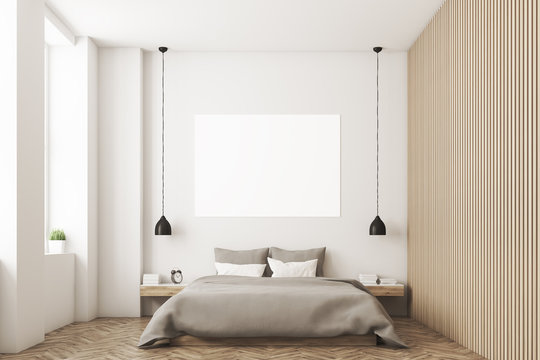 Bedroom with picture and wooden wall