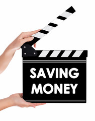 Hands holding a clapper board with SAVING MONEY text