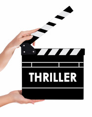 Obraz premium Hands holding a clapper board with THRILLER text