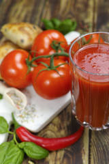 Raw Organic red Tomato Juice with salt, basil and bread