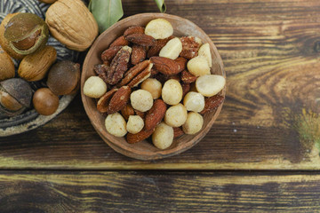 Roasted salted nuts mix, snack from macadamia, walnotes and almonds
