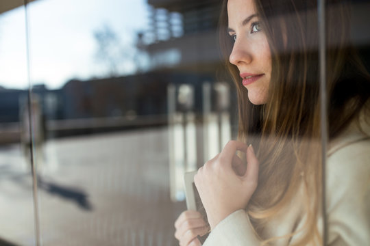 Portrait Of A Businesswoman With A Glass Reflection