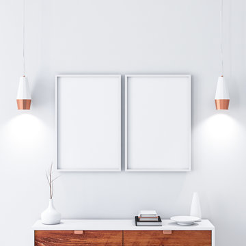 Two White poster Frames hanging on the wall in modern interior. 3d rendering