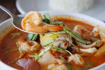 Tom Yum Kung or Tom Yum Goong is famous Thai dish is sour soup with lemon grass and other herb with shrimp   