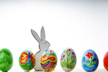 Easter composition with colorful Easter eggs and rabbit