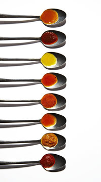 Teaspoons with sauces and spices