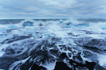 Jokulsarlon glacier lagoon, fantastic sunset on the black beach,