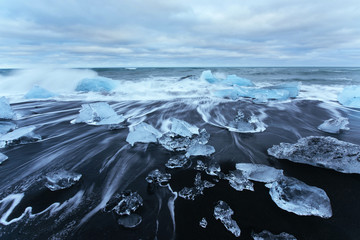 Jokulsarlon glacier lagoon, fantastic sunset on the black beach,