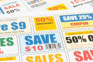 Saving coupon voucher with scissors, coupons are mock-up