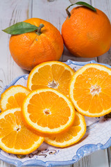 Giant ripe organic oranges from farm in Spain with leaves