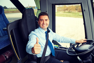 happy driver driving bus and snowing thumbs up - obrazy, fototapety, plakaty