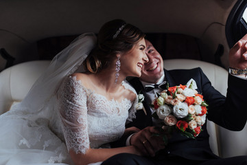 Happy man and woman smiling rejoicing in wedding day