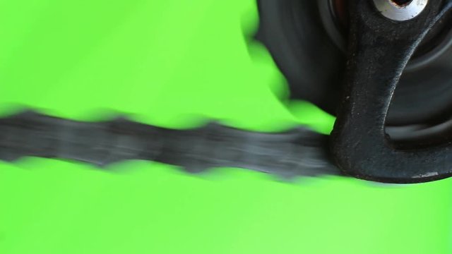 Green screen close up of a bicycle chain and derailleur pulley in action