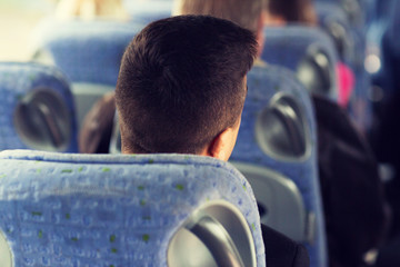 close up of man sitting in travel bus