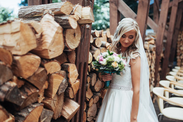 Portrait of gorgeous bride with a wedding bouquet