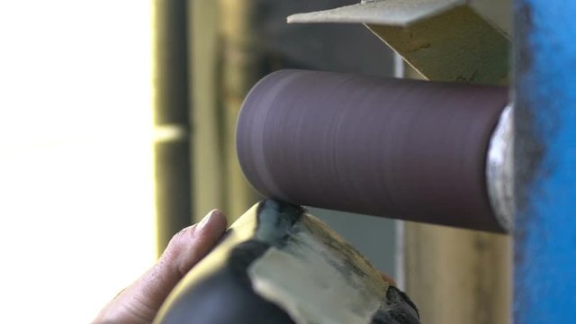 the manufacture of soles and turning the soles of orthopaedic shoes with sandpaper
