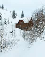 House on winter slope.