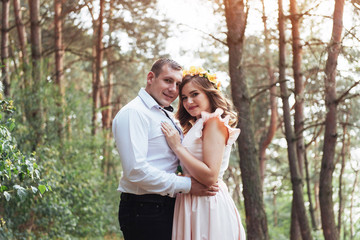 Happy couple in a pine forest Beauty world